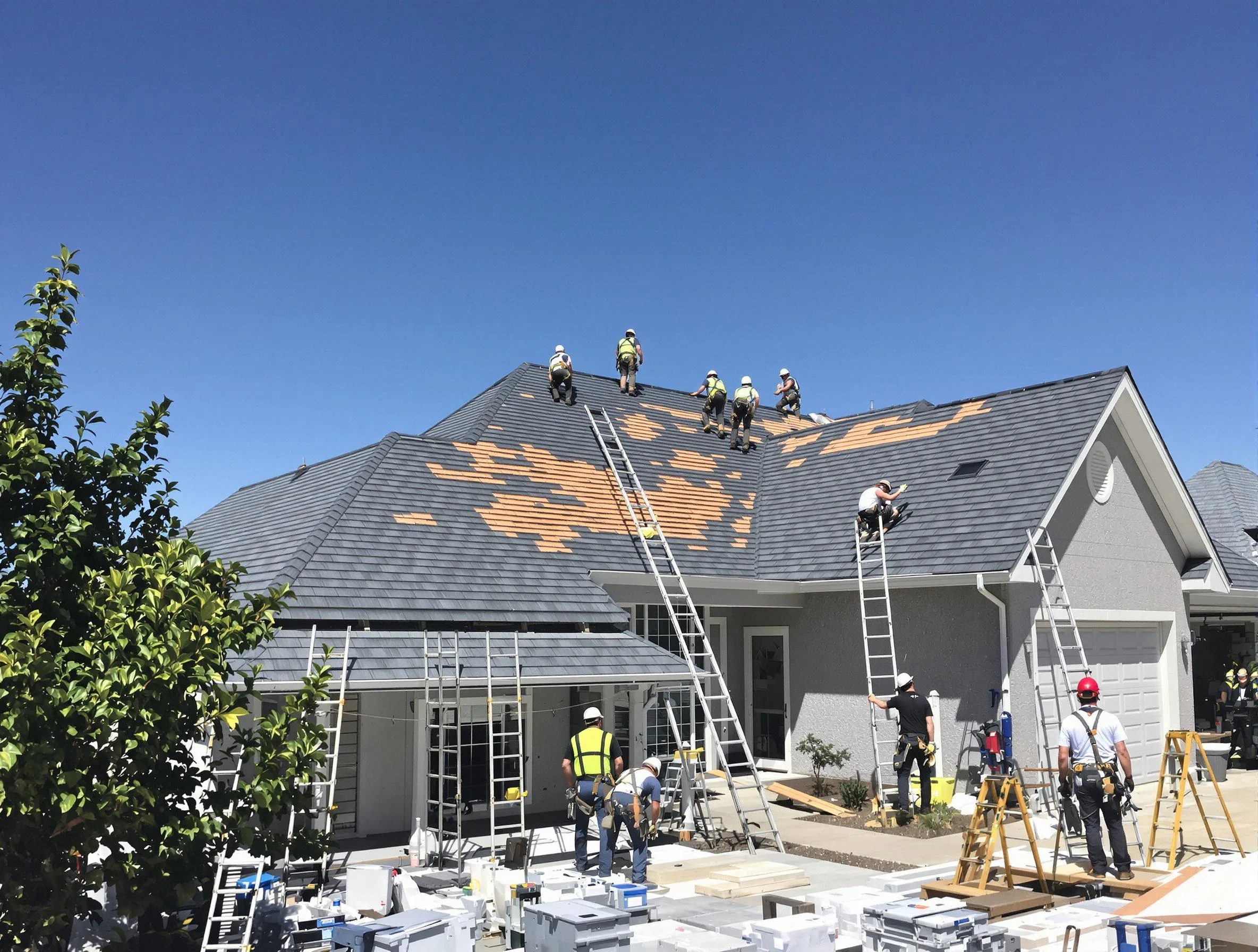 Workers installing a complete residential roof